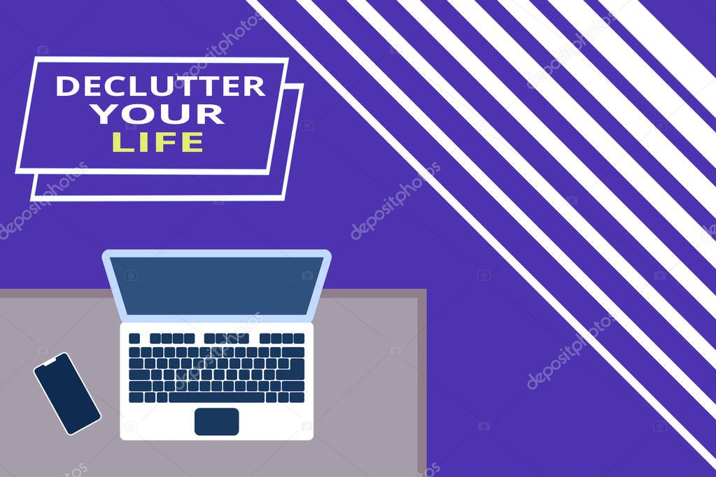 Conceptual hand writing showing Declutter Your Life. Business photo text To eliminate extraneous things or information in life Office working place laptop lying wooden desk smartphone.