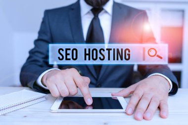 Conceptual hand writing showing Seo Hosting. Business photo text building website in a way that is friendly for search engines Male human wear formal clothes present use hitech smartphone.