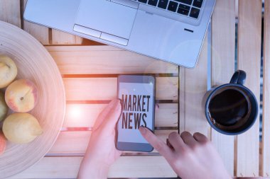 Handwriting text writing Market News. Concept meaning Commercial Notice Trade Report Market Update Corporate Insight woman computer smartphone drink mug office supplies technological devices.