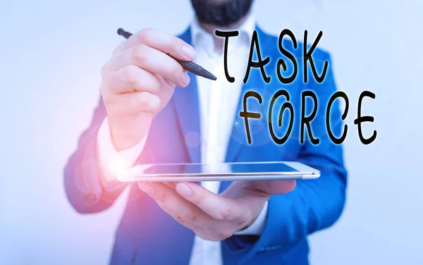 Handwriting text Task Force. Concept meaning a group of showing who are brought together to do a particular job Businessman pointing with pen in empty copy space. — Stock Photo, Image