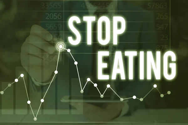 Handwriting text Stop Eating. Concept meaning cease the activity of putting or taking food into the mouth.