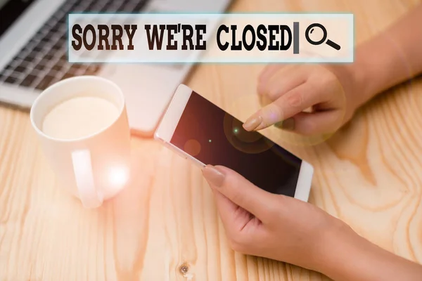 Writing note showing Sorry We Re Closed. Business photo showcasing Expression of Regret Disappointment Not Open Sign woman with laptop smartphone and office supplies technology. — Stock Photo, Image