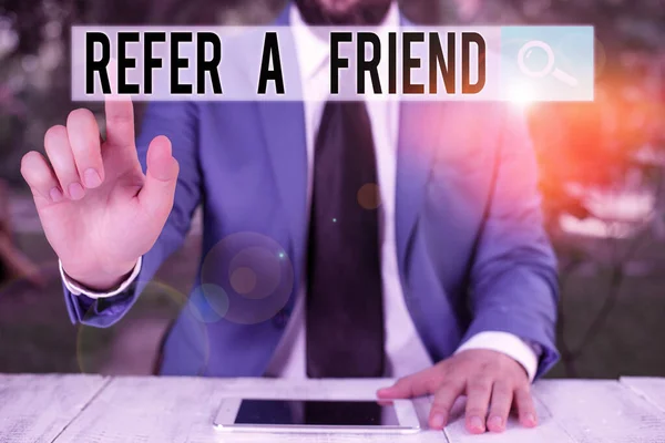 Conceptual hand writing showing Refer A Friend. Business photo showcasing Recommendation Appoint someone qualified for the task Businessman with pointing finger in front of him. — Stock Photo, Image