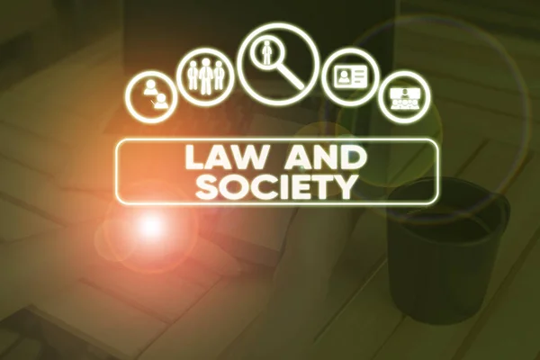 Conceptual hand writing showing Law And Society. Business photo text Address the mutual relationship between law and society.