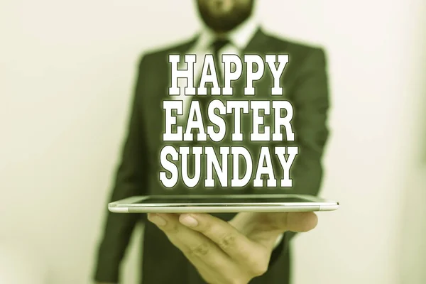Word writing text Happy Easter Sunday. Business concept for Greeting someone about holidays Spring is coming Male human wear formal work suit hold smart hi tech smartphone use one hand.