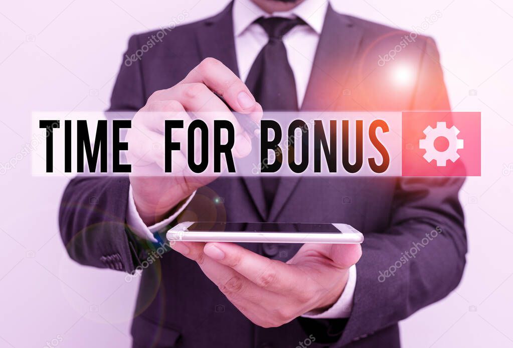 Text sign showing Time For Bonus. Conceptual photo a sum of money added to a demonstrating s is wages as a reward Male human wear formal work suit hold smart hi tech smartphone use one hand.