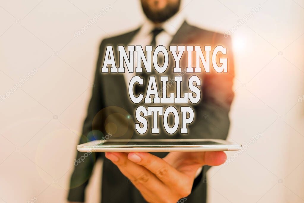 Word writing text Annoying Calls Stop. Business concept for Prevent spam phones Blacklisting numbers Angry caller Male human wear formal work suit hold smart hi tech smartphone use one hand.
