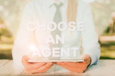 Handwriting text writing Choose An Agent. Concept meaning Choose someone who chooses decisions on behalf of you Female business person sitting by table and holding mobile phone.
