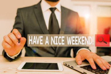 Text sign showing Have A Nice Weekend. Conceptual photo wishing someone that something nice happen holiday Male human wear formal clothes present presentation use hi tech smartphone.