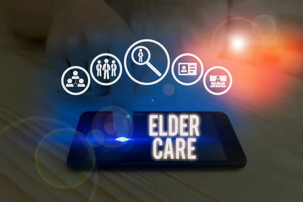 Writing note showing Elder Care. Business photo showcasing the care of older showing who need help with medical problems. — Stok fotoğraf