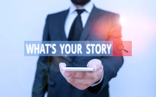 Word writing text What S Your Story. Business concept for asking someone tell me about himself Share experience Male human wear formal work suit hold smart hi tech smartphone use one hand.