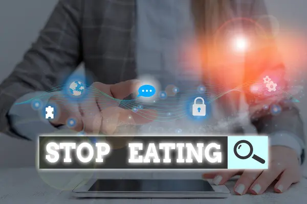 Conceptual hand writing showing Stop Eating. Business photo showcasing cease the activity of putting or taking food into the mouth.