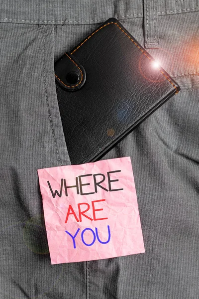 Text sign showing Where Are You. Conceptual photo Give us your location address direction point of reference Small little wallet inside man trousers front pocket near notation paper. — Stock Photo, Image