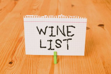 Word writing text Wine List. Business concept for menu of wine selections for purchase typically in a restaurant Empty reminder wooden floor background green clothespin groove slot office.