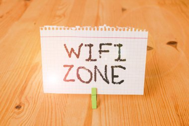 Word writing text Wifi Zone. Business concept for provide wireless highspeed Internet and network connections Empty reminder wooden floor background green clothespin groove slot office.
