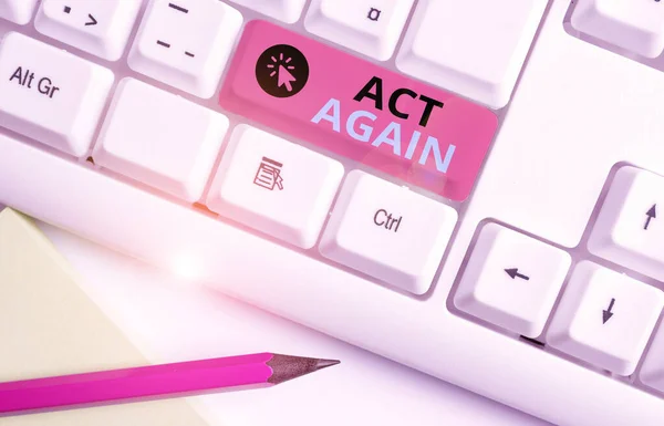 Conceptual hand writing showing Act Again. Business photo text do something for a particular purpose Take action on something White pc keyboard with note paper above the white background. — 图库照片