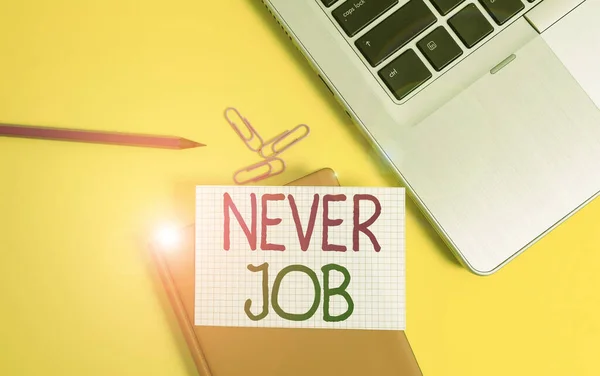 Writing note showing Never Job. Business photo showcasing Choosing a job that you enjoy and enhance will your abilities Laptop clips pencil paper sheet hard cover notebook colored background.