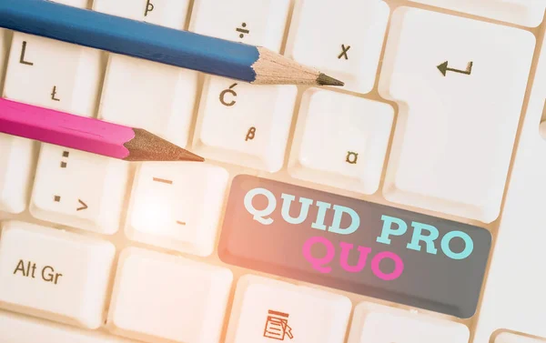 Conceptual hand writing showing Quid Pro Quo. Business photo showcasing A favor or advantage granted or expected in return of something White pc keyboard with note paper above the white background.