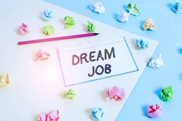 Word writing text Dream Job. Business concept for An act that is paid of by salary and giving you hapiness Colored crumpled papers empty reminder blue yellow background clothespin.