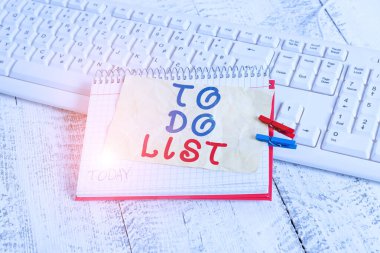 Conceptual hand writing showing To Do List. Business photo text A structure that usualy made in paper contining task of yours notebook reminder clothespin with pinned sheet light wooden. clipart