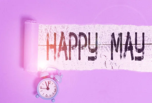 Word writing text Happy May. Business concept for Happy new month Best wishes Fresh Start Celebrating Holiday Alarm clock and torn cardboard placed above a wooden classic table backdrop. — Stock Photo, Image