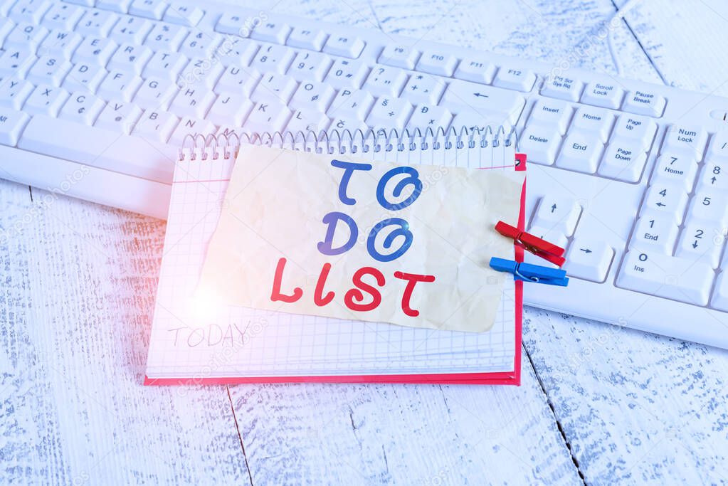 Conceptual hand writing showing To Do List. Business photo text A structure that usualy made in paper contining task of yours notebook reminder clothespin with pinned sheet light wooden.