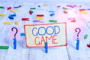 Word writing text Good Game. Business concept for term frequently used in multiplayer gaming at the end of a match Scribbled and crumbling sheet with paper clips placed on the wooden table. clipart