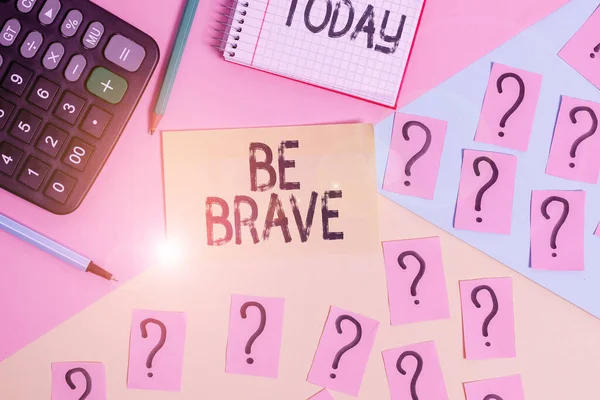 Conceptual hand writing showing Be Brave. Business photo text ready to face and endure danger or pain showing courage Bold Mathematics stuff and writing equipment on pastel background.