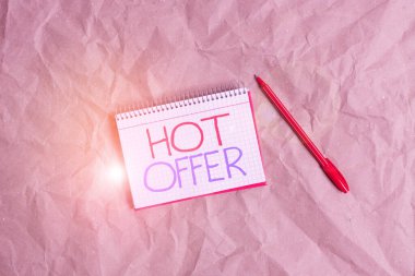 Writing note showing Hot Offer. Business photo showcasing product or programme that is offered at reduced prices or rates Papercraft desk square spiral notebook office study supplies.