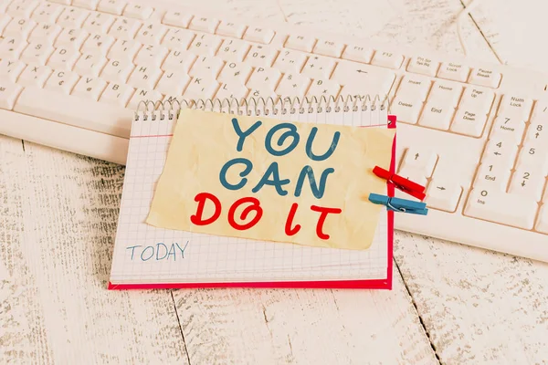 Conceptual hand writing showing You Can Do It. Business photo text Bring it On Believing to oneself Give a try Take the chance notebook reminder clothespin with pinned sheet light wooden.