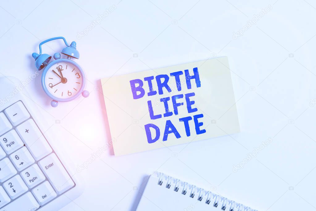 Conceptual hand writing showing Birth Life Date. Business photo text Day a baby is going to be born Maternity Pregnancy Give life Keyboard with empty note paper and pencil white background.