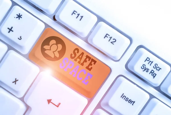 Writing note showing Safe Space. Business photo showcasing a place or room in which you are protected from harm or danger White pc keyboard with note paper above the white background.