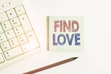 Handwriting text Find Love. Concept meaning affection for another arising out of kinship or demonstratingal ties White pc keyboard with empty note paper and pencil above white background.