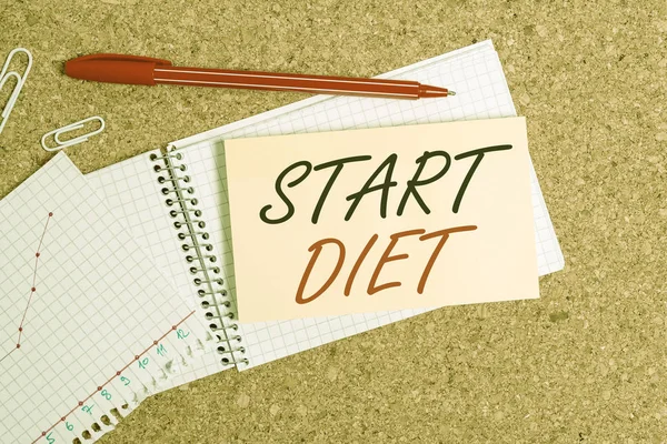 Handwriting text Start Diet. Concept meaning special course food to which demonstrating restricts themselves Desk notebook paper office cardboard paperboard study supplies table chart. — ストック写真