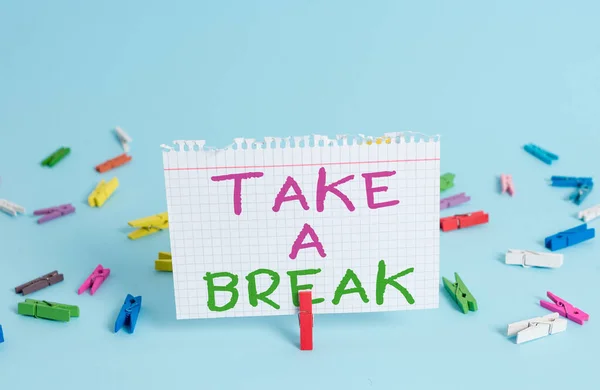 Word writing text Take A Break. Business concept for Resting Stop doing something recreation time get out of work Colored clothespin rectangle square shaped paper light blue background. — Stock Photo, Image