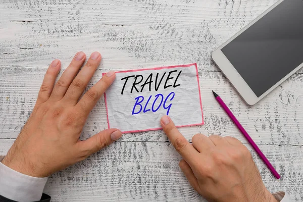 Writing note showing Travel Blog. Business photo showcasing Sharing thoughts and experiences of the places around the world Hand hold note paper near writing equipment and smartphone. — Stock Photo, Image