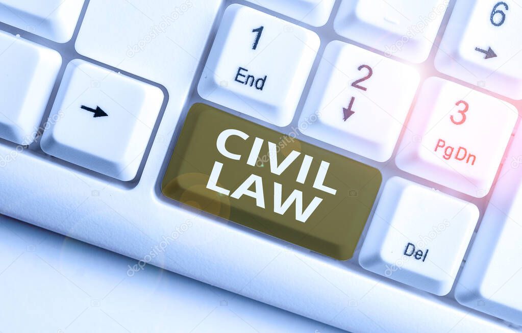 Writing note showing Civil Law. Business photo showcasing Law concerned with private relations between members of community White pc keyboard with note paper above the white background.