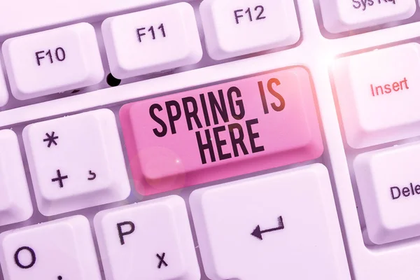 Writing note showing Spring Is Here. Business photo showcasing After winter season has arrived Enjoy nature flowers sun Keyboard with note paper on white background key copy space. — ストック写真