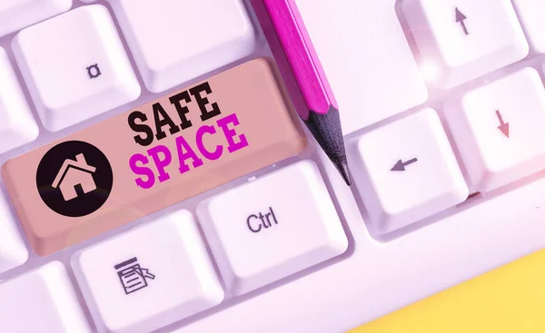 Handwriting text writing Safe Space. Concept meaning a place or room in which you are protected from harm or danger White pc keyboard with empty note paper above white background key copy space.