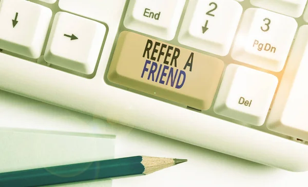 Word writing text Refer A Friend. Business concept for Recommendation Appoint someone qualified for the task White pc keyboard with empty note paper above white background key copy space. — Stock Photo, Image