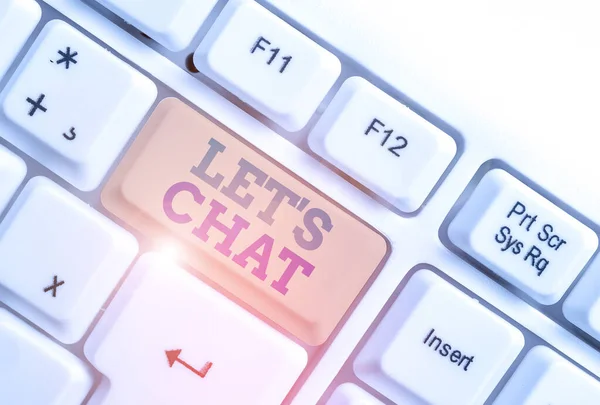 Handwriting text writing Let S Is Chat. Concept meaning inviting the demonstrating to have informal conversation with you White pc keyboard with empty note paper above white background key copy space. — Stock Photo, Image