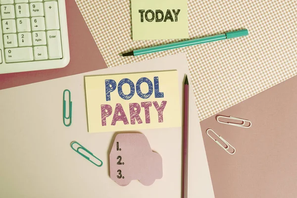 Writing note showing Pool Party. Business photo showcasing celebration that includes activitites in a swimming pool Writing equipments and computer stuffs placed above colored plain table. — Stock Photo, Image