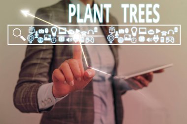 Metin işareti Bitki Ağaçlarını gösteriyor. Arazi ekimi ve ormancılık için ağaç dikme kavramsal fotoğraf süreci.