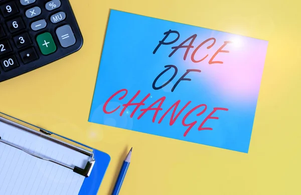 Writing note showing Pace Of Change. Business photo showcasing Shift in normal routine Variation in usual activities Clipboard blank sheet square page calculator pencil colored background. — Stockfoto