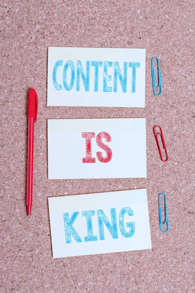 Writing note showing Content Is King. Business photo showcasing words what sells products and provide good marketing Empty sticker reminder memo billboard corkboard desk paper. — Stock Photo, Image