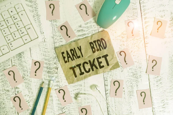 Text sign showing Early Bird Ticket. Conceptual photo Buying a ticket before it go out for sale in regular price Writing tools, computer stuff and scribbled paper on top of wooden table.
