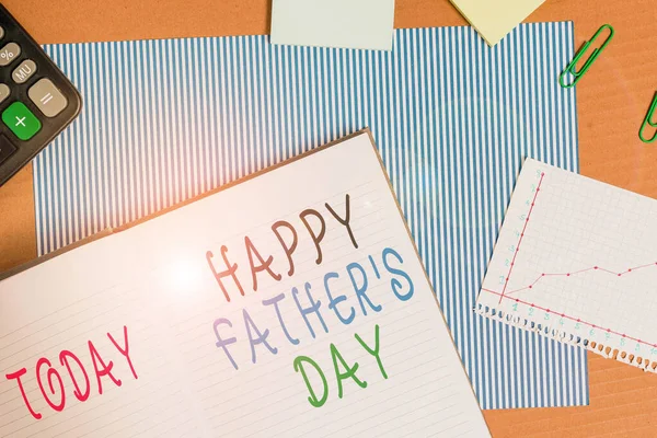 Handwriting text writing Happy Father S Day. Concept meaning time of year to celebrate fathers all over the world Striped paperboard notebook cardboard office study supplies chart paper.