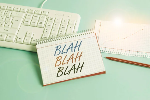 Text sign showing Blah Blah Blah. Conceptual photo Talking too much false information gossips nonsense speaking Paper blue desk computer keyboard office study notebook chart numbers memo.