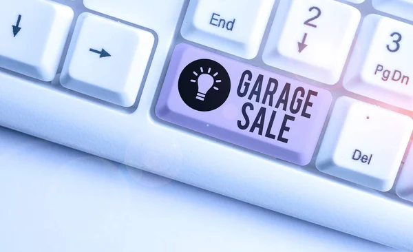 Text sign showing Garage Sale. Conceptual photo sale of miscellaneous household goods often held in the garage White pc keyboard with empty note paper above white background key copy space. — ストック写真