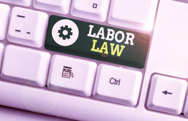 Writing note showing Labor Law. Business photo showcasing rules relating to rights and responsibilities of workers White pc keyboard with note paper above the white background.